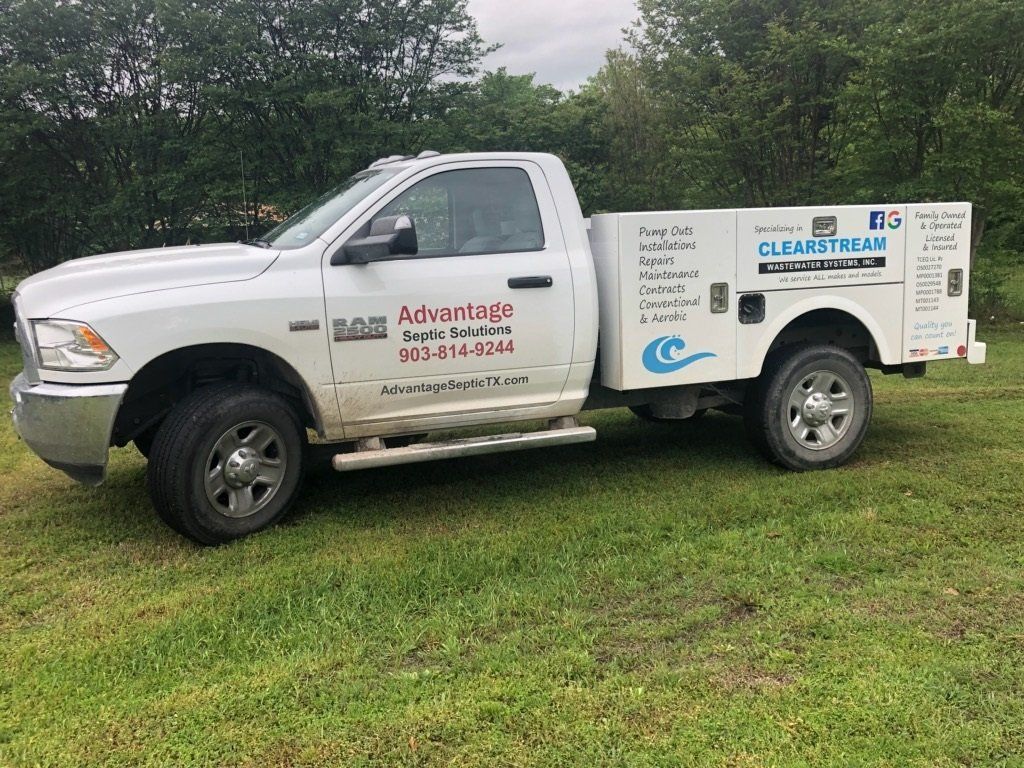 Advantage Septic Solutions white pick up truck