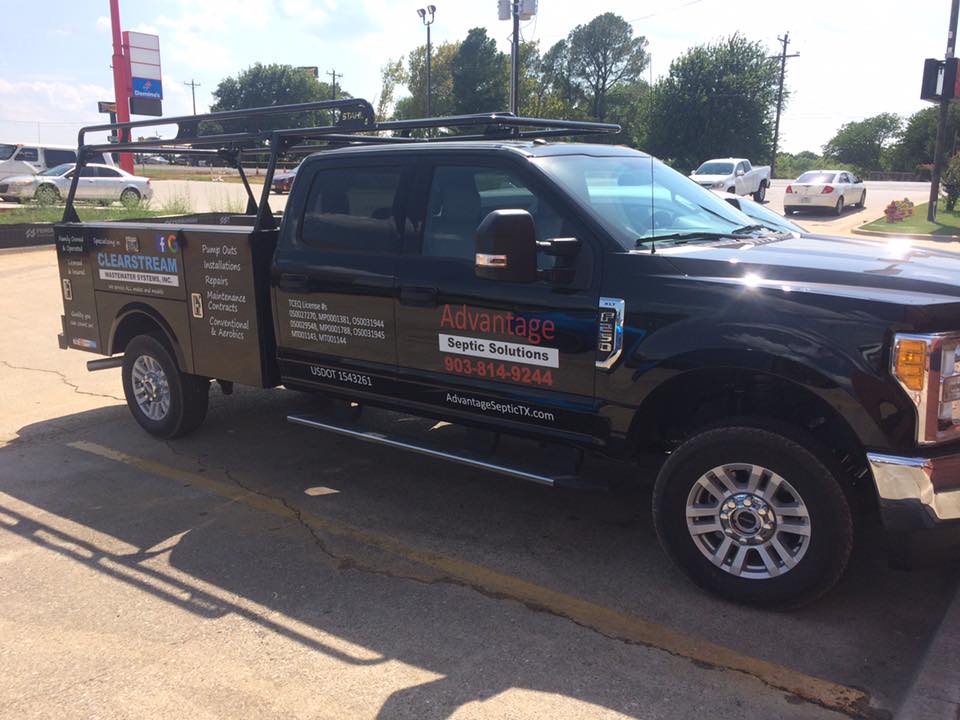 Advantage Septic Solutions black pick up truck