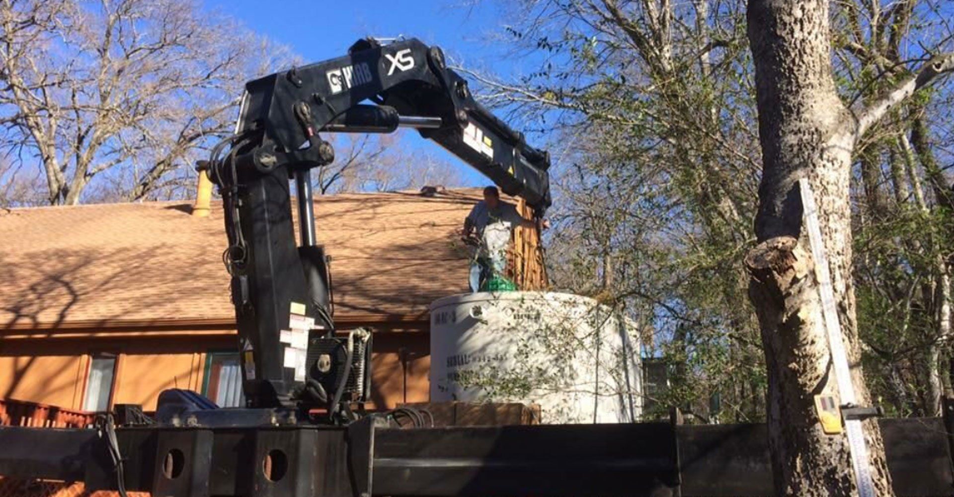 Equipment lifting the septic tank