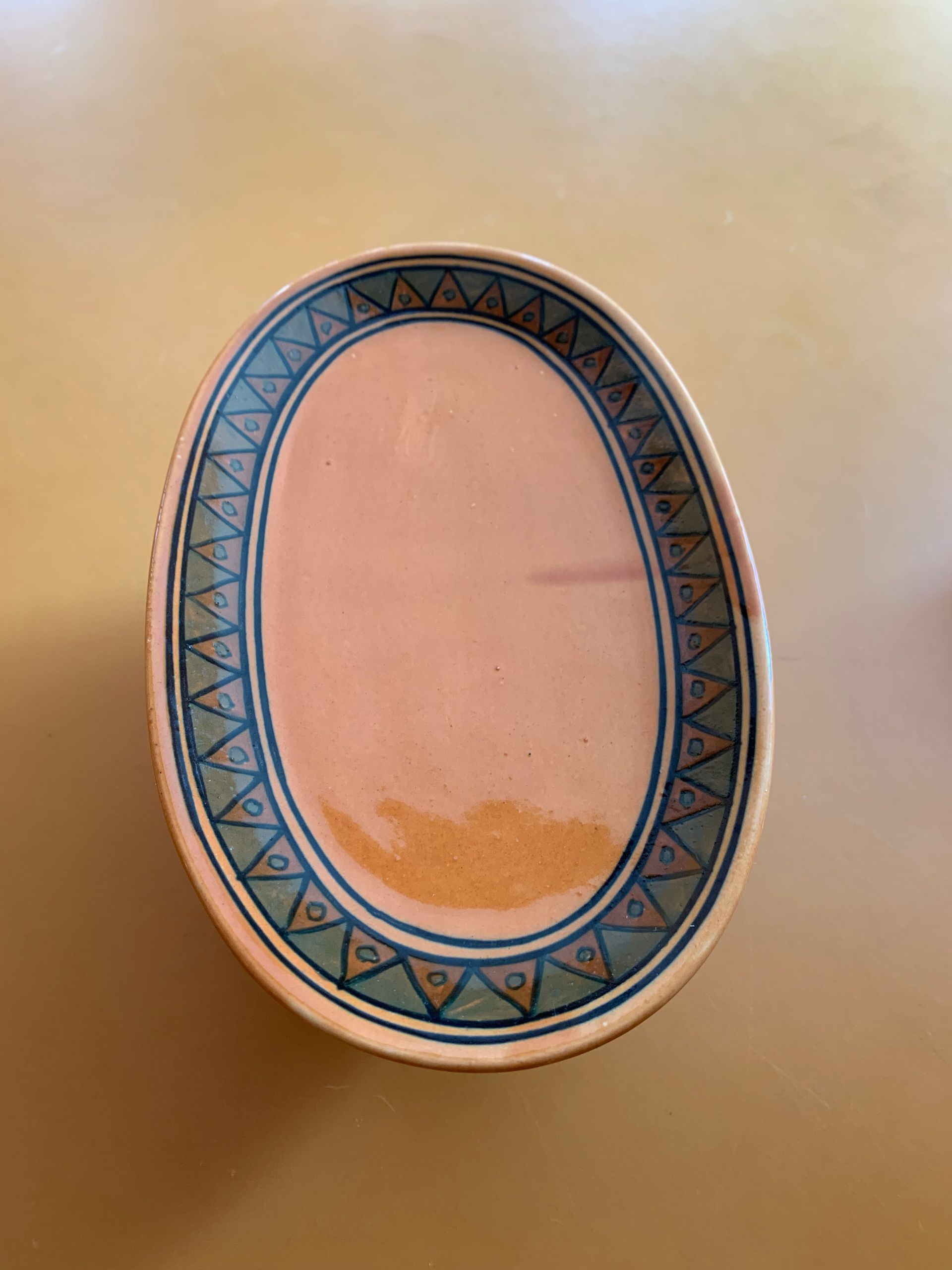 A plate with a blue rim is sitting on a table