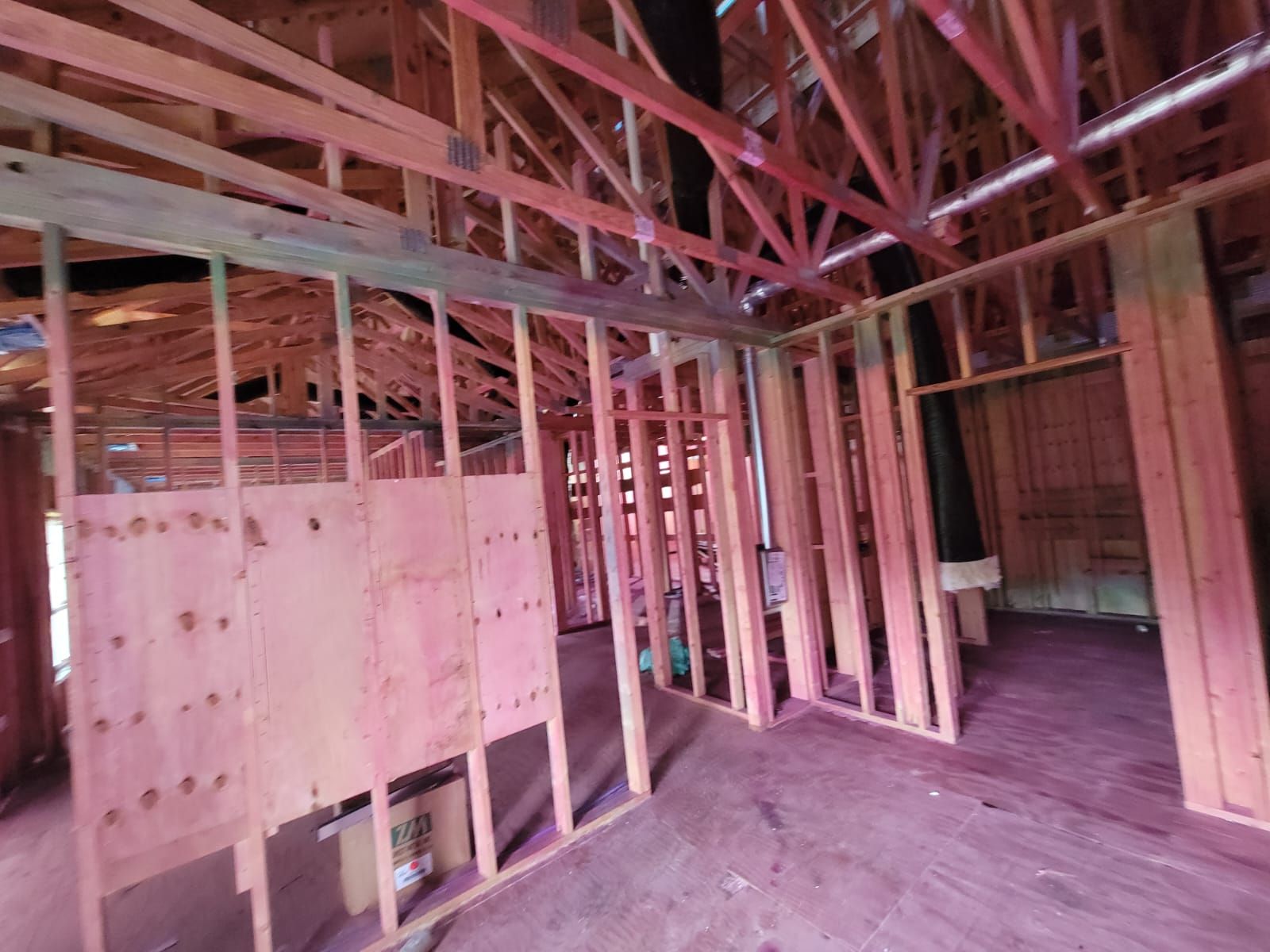 Interior of a building under construction, wooden frames visible.