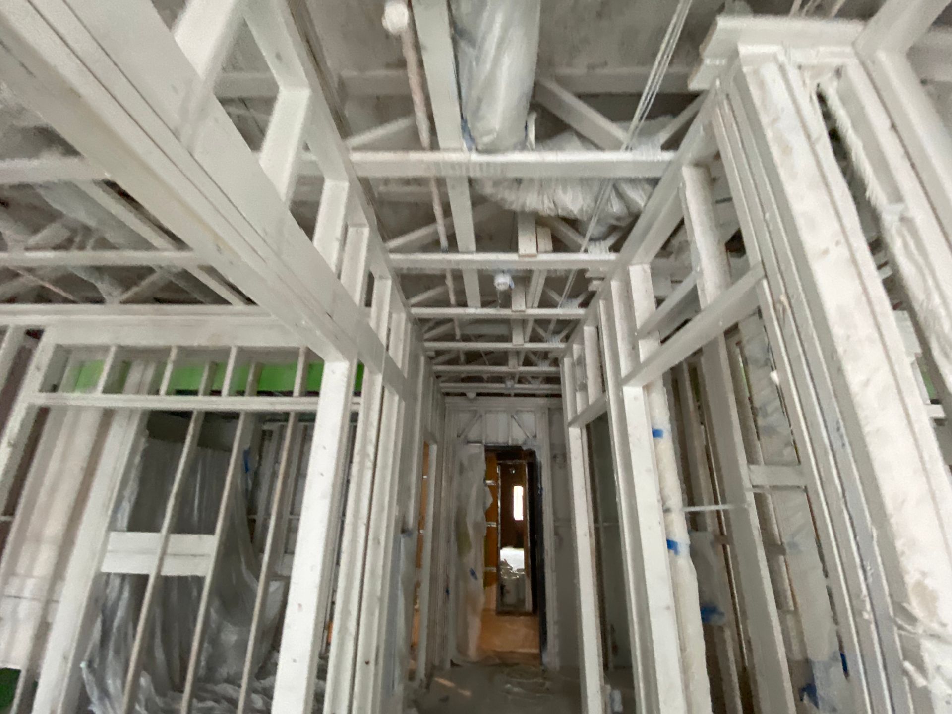 Interior view of a building's wooden framework under construction.