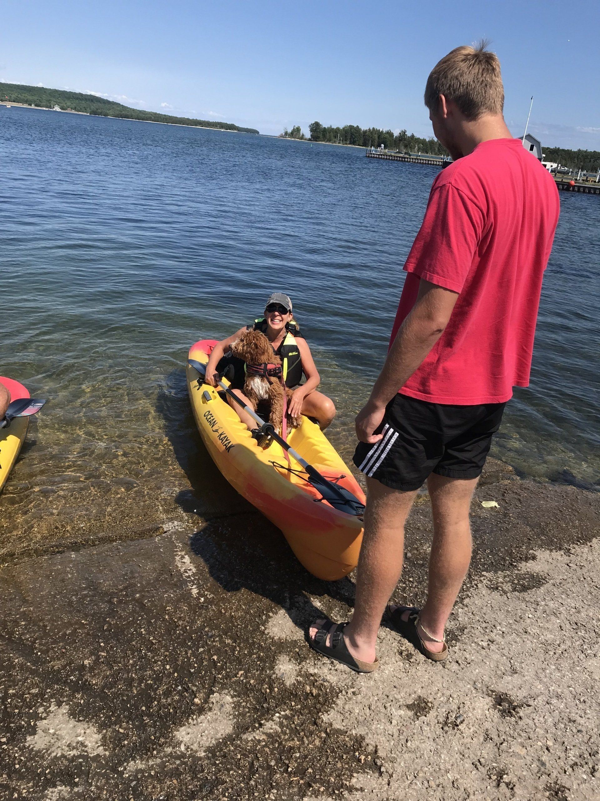 Women and dog on a kayak