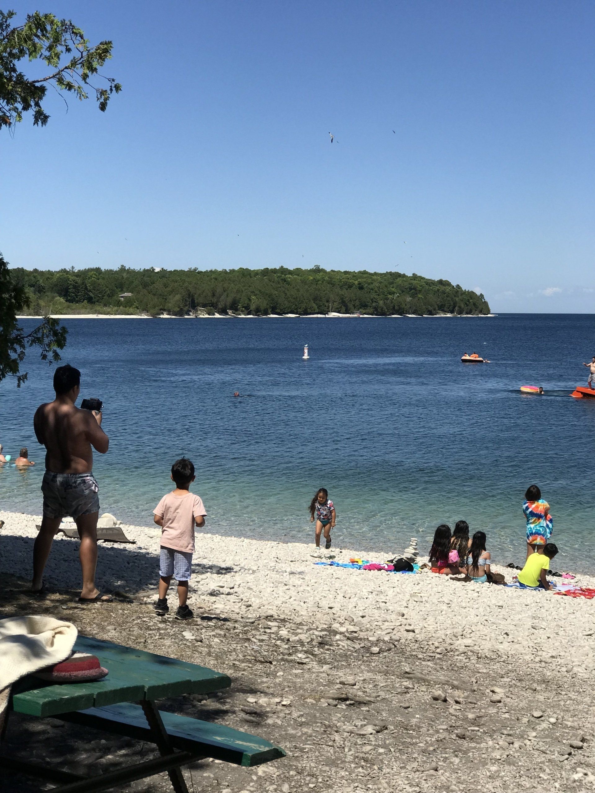 People gathered on the beach shore