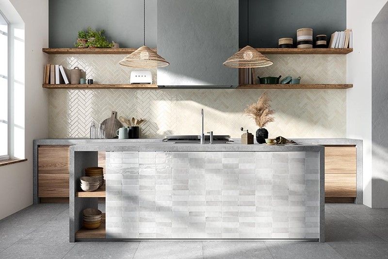 A kitchen with a large island in the middle of the room.