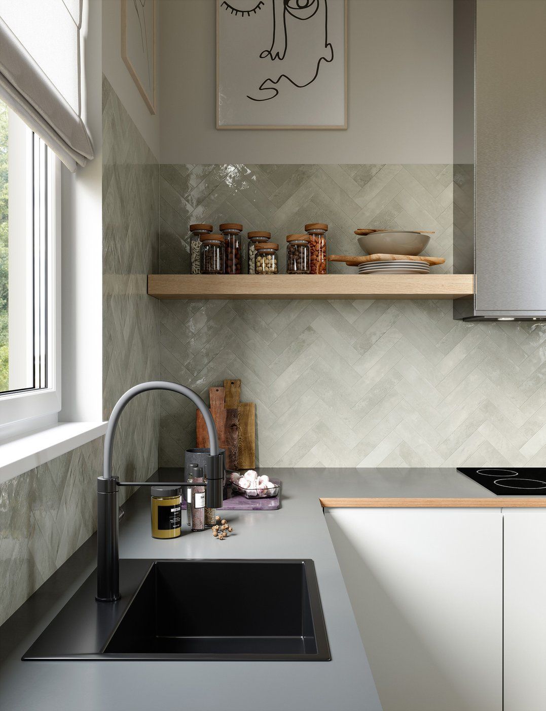 A kitchen with a black sink and a painting on the wall above it