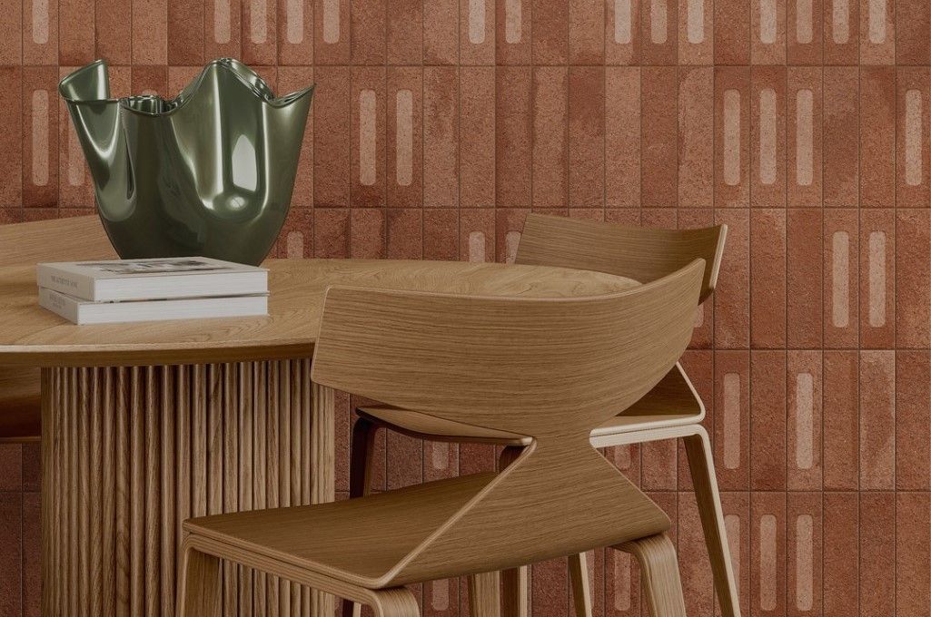 A dining room with a table and chairs and a vase on the table.
