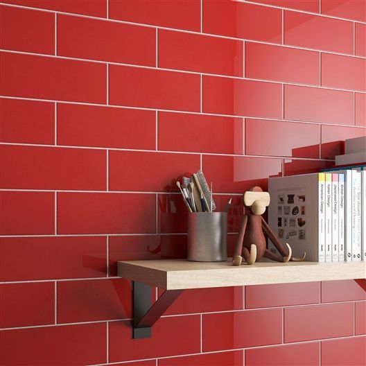 A shelf with a monkey and a pencil holder on it