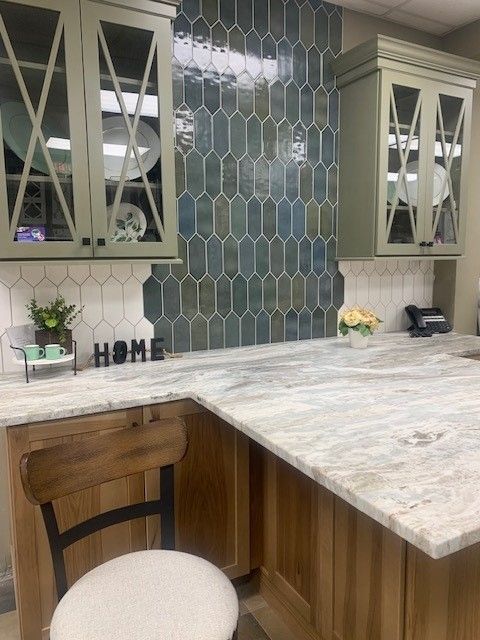 A kitchen with a chair and a sign that says home