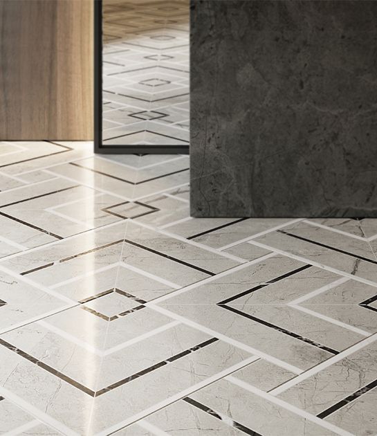 A marble floor with a herringbone pattern and a mirror.