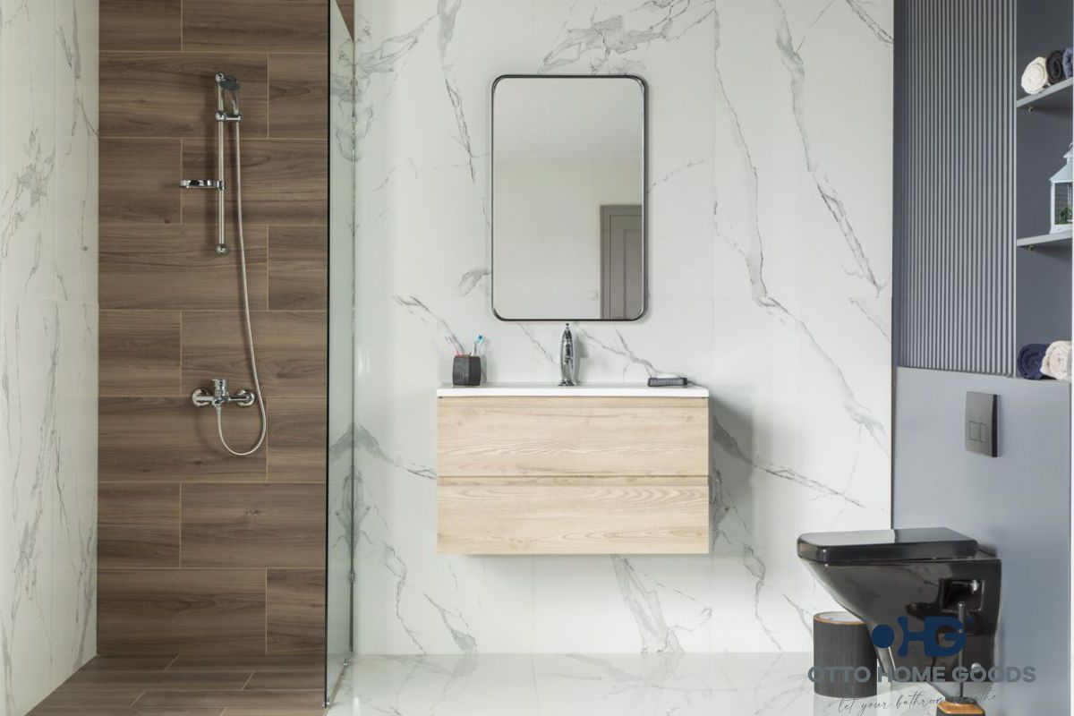 A bathroom with a sink , toilet , shower and mirror.