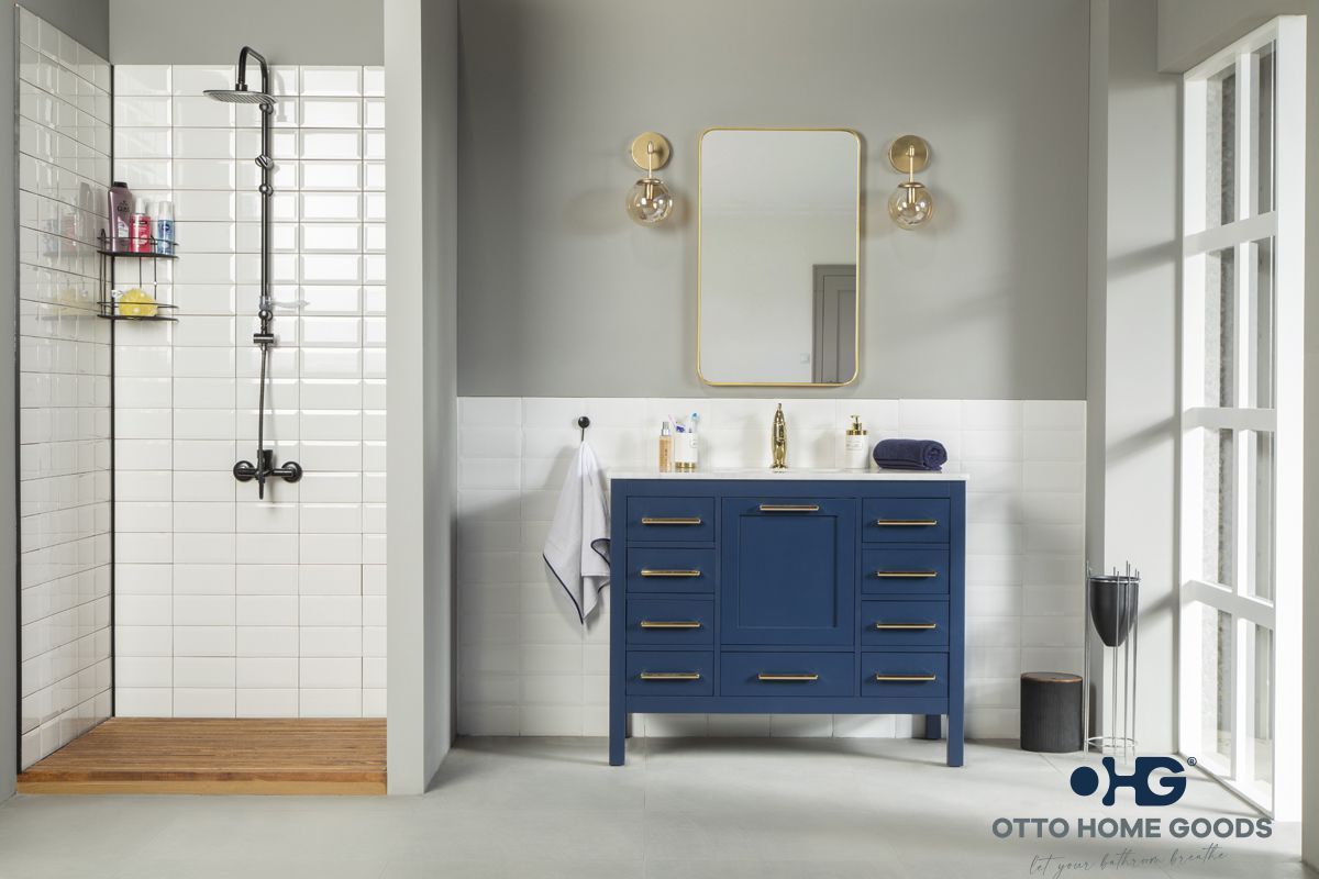 A bathroom with a blue vanity and a shower.