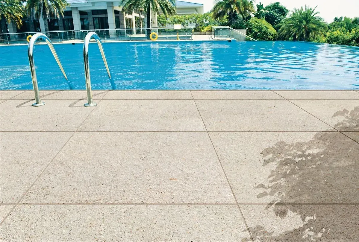 A swimming pool with a ladder leading to it.