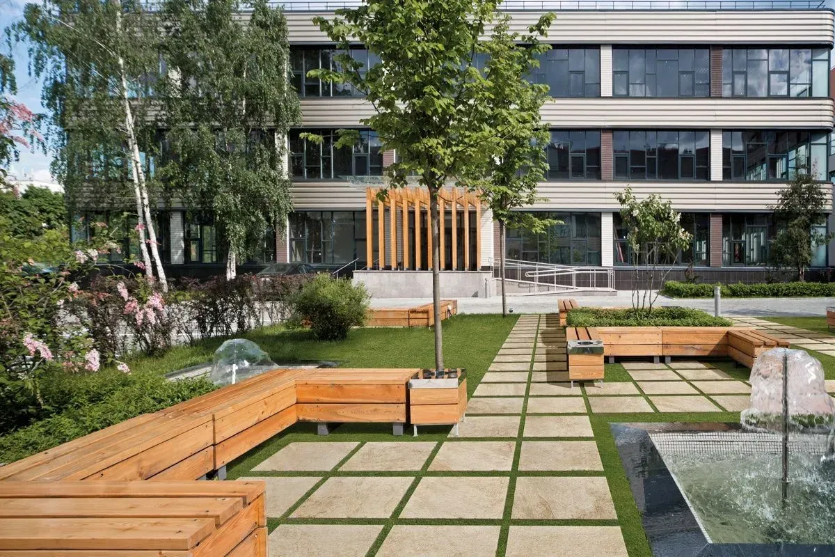 A large building with a fountain in front of it.