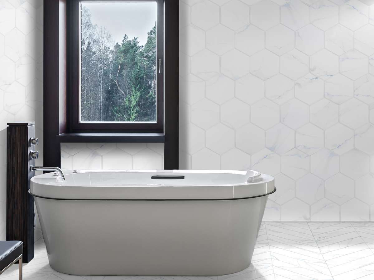 A bathroom with a bathtub and a window.