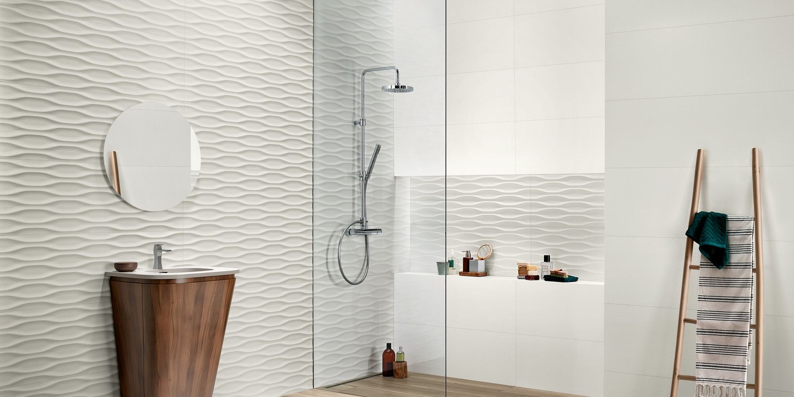 A bathroom with a sink and a walk in shower.