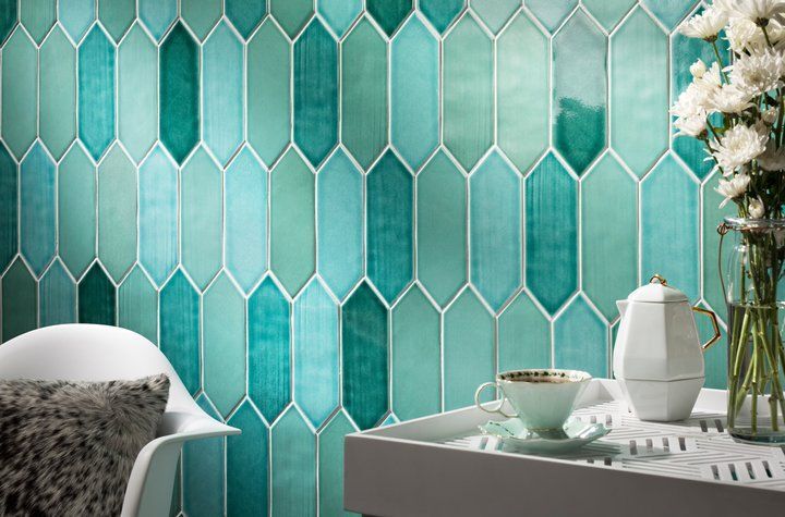 There is a tray with a cup of tea and a vase of flowers on it.