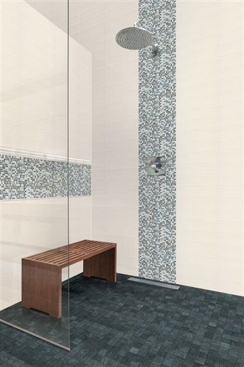 A bathroom with a walk in shower and a bench