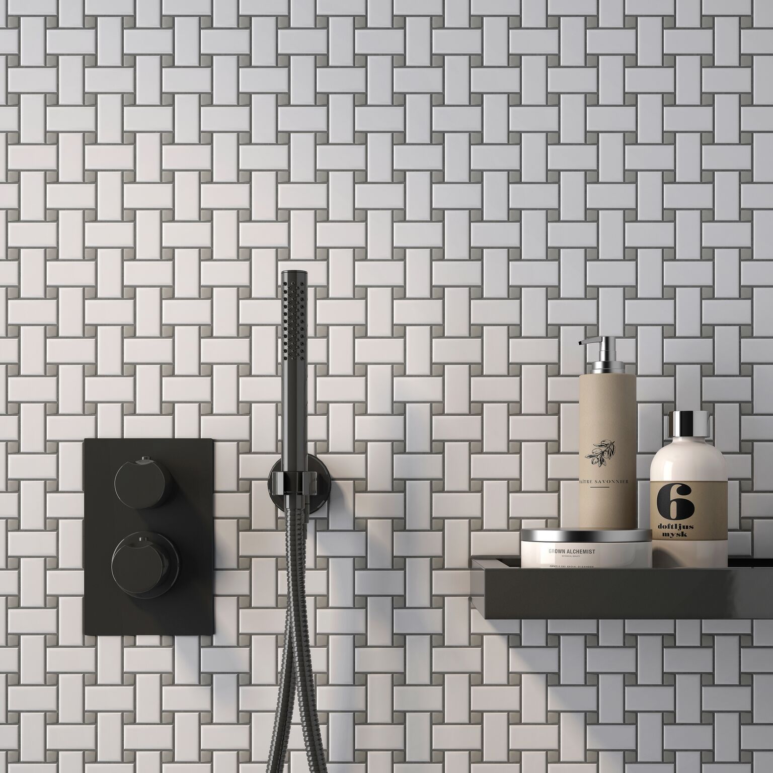 A bathroom with white tiles and a black shower head