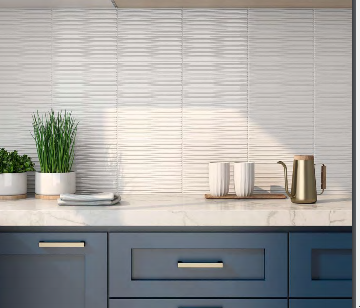 A kitchen counter with blue cabinets and a marble counter top.