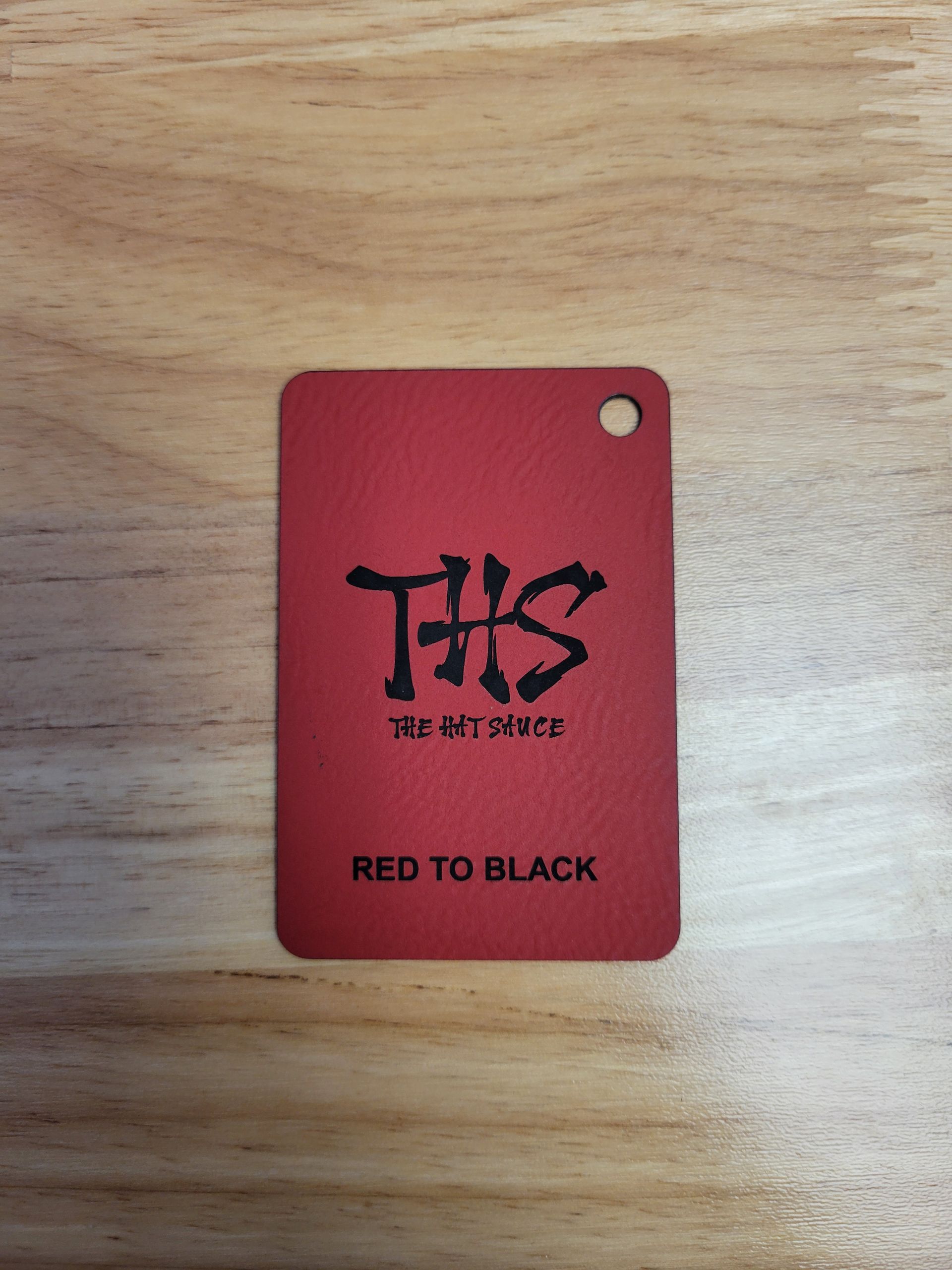 A red tag with the letters ths on it