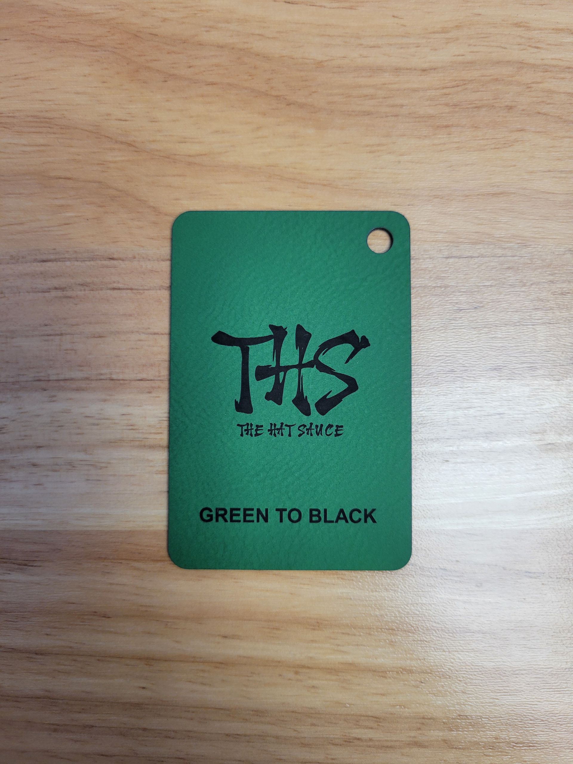 A green tag that says ths green to black