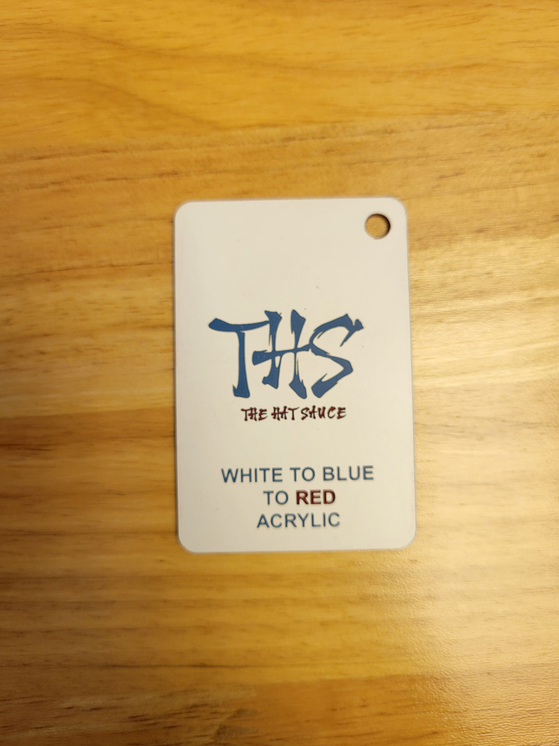 A white tag that says ths on it