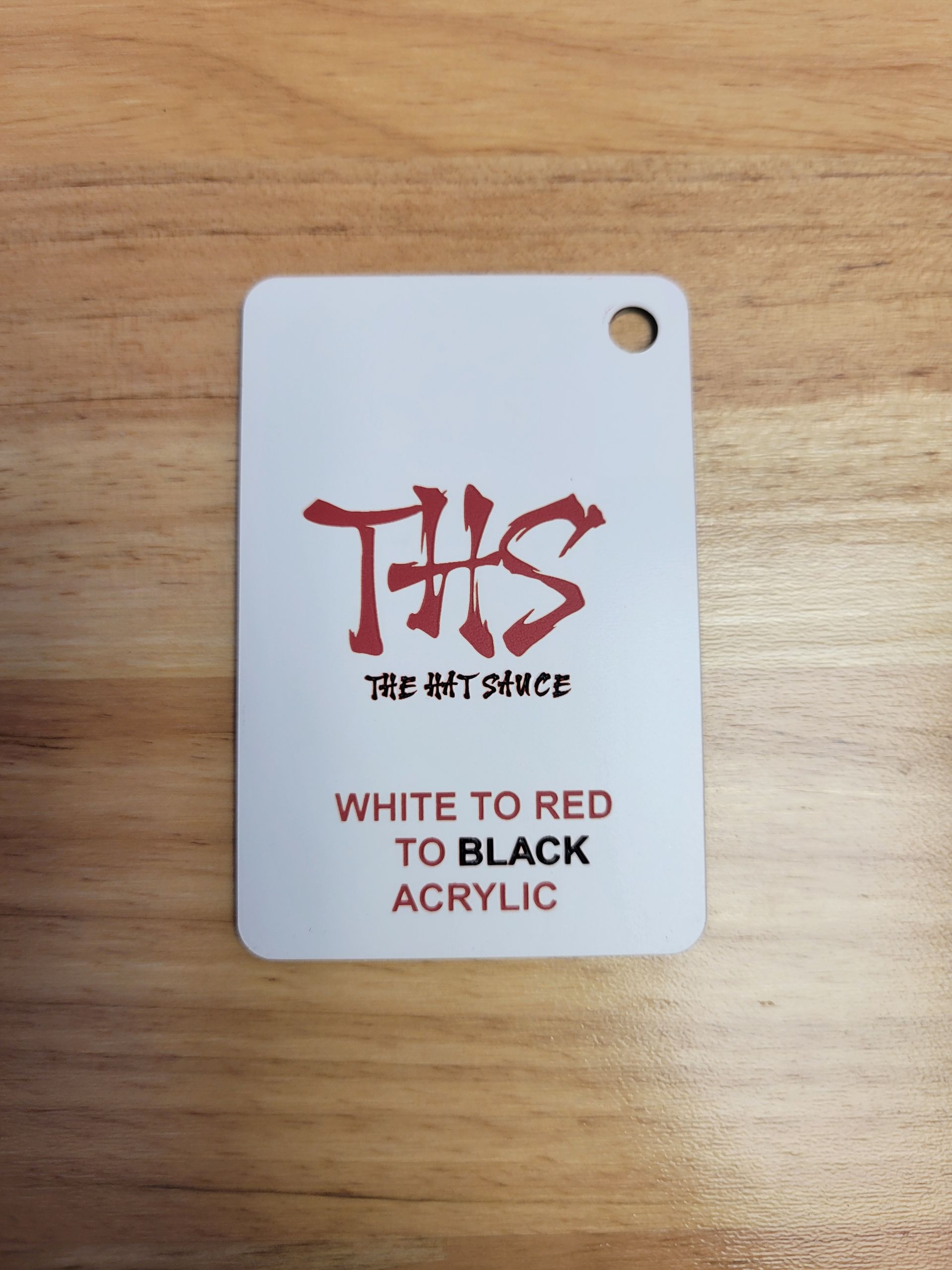 A white tag that says ths on it