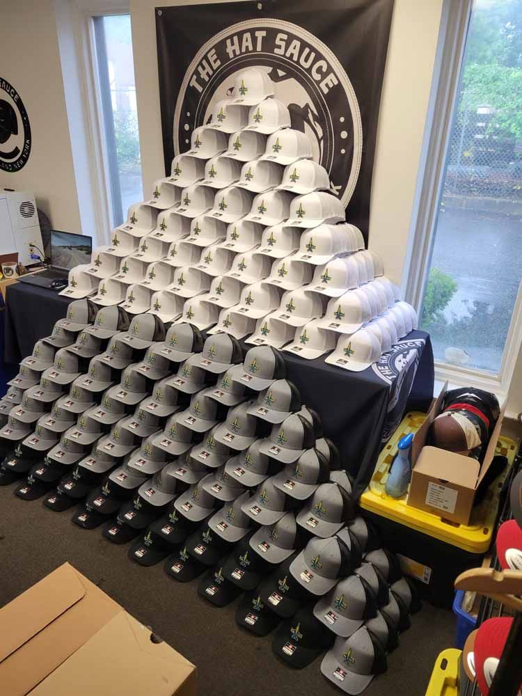 A bunch of hats are stacked on top of each other in a room.