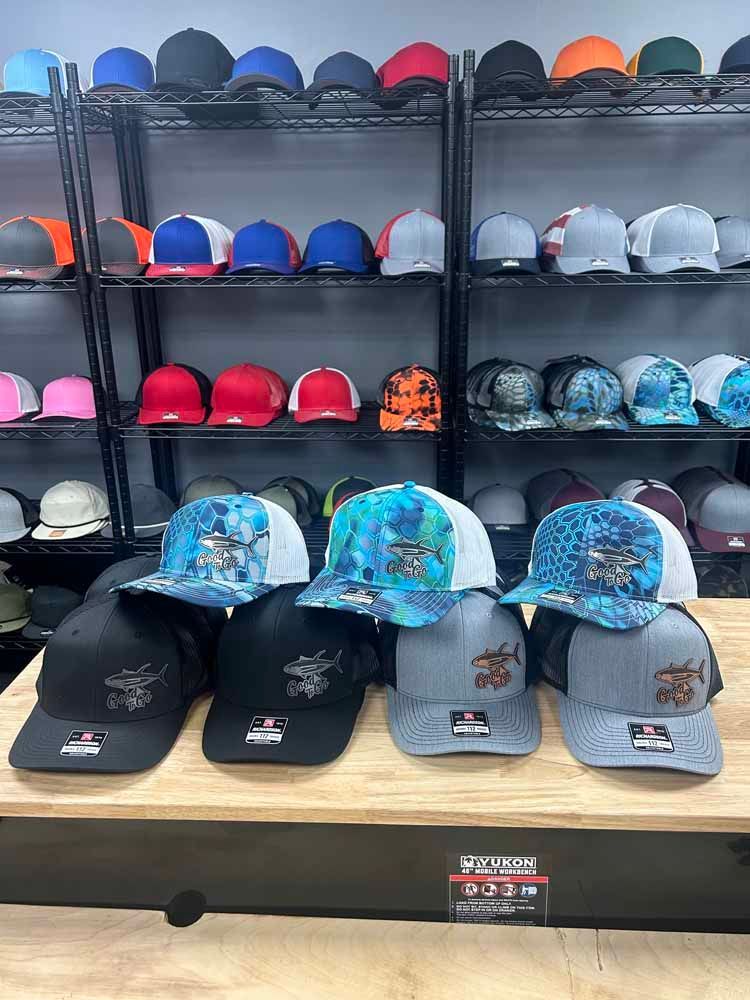 A bunch of hats are sitting on a table in a store.
