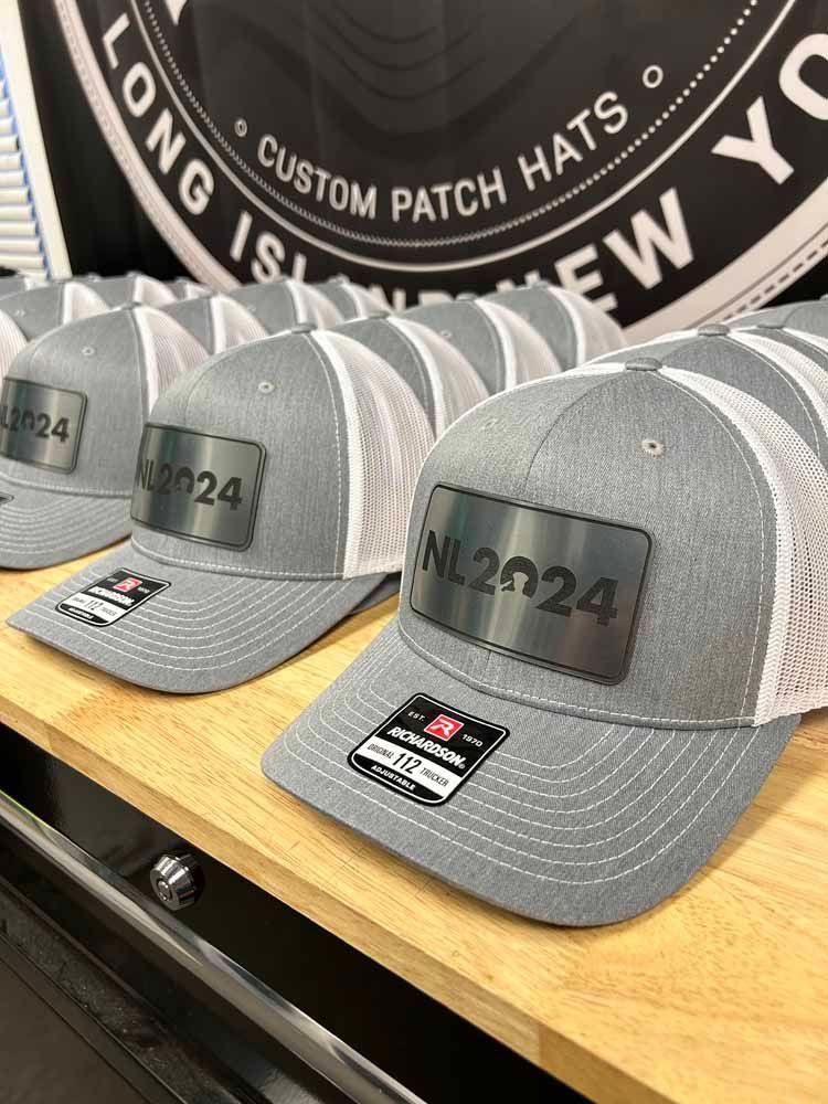 A row of hats sitting on top of a wooden shelf.