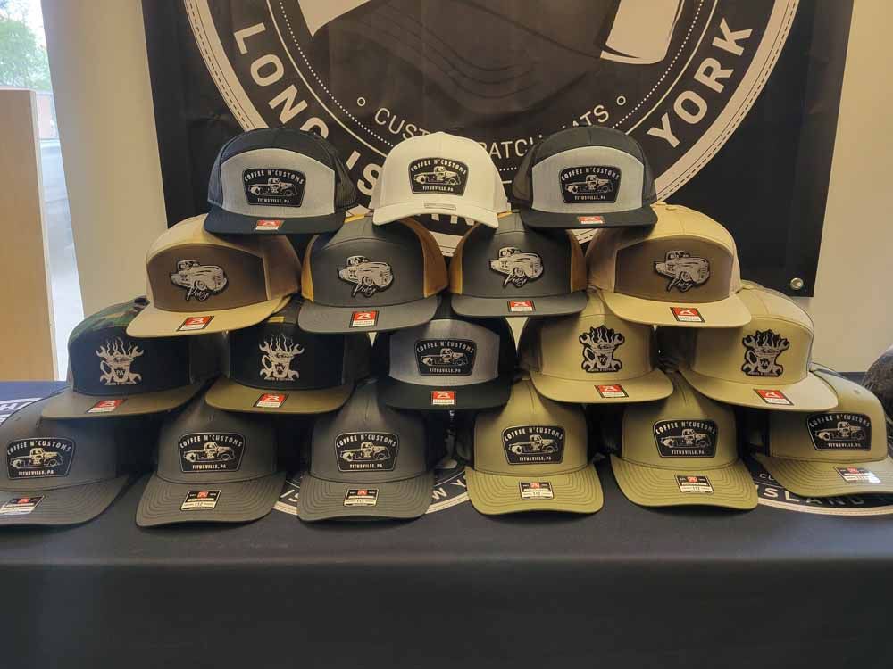 A bunch of hats are stacked on top of each other on a table.