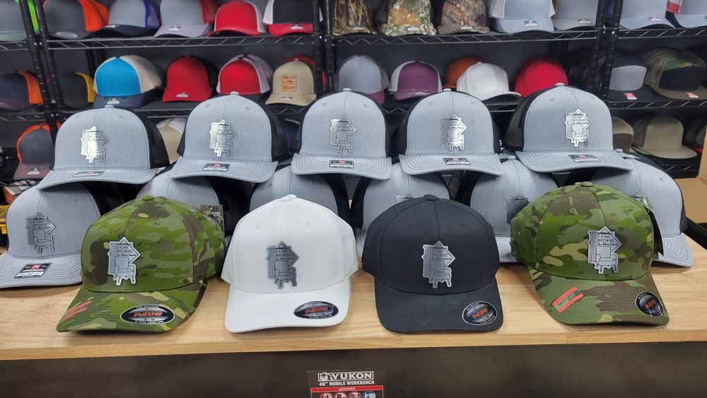 A bunch of hats are sitting on a table in a store.