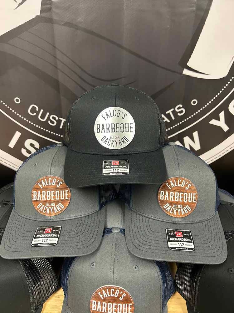 A bunch of hats are sitting on top of each other on a table.