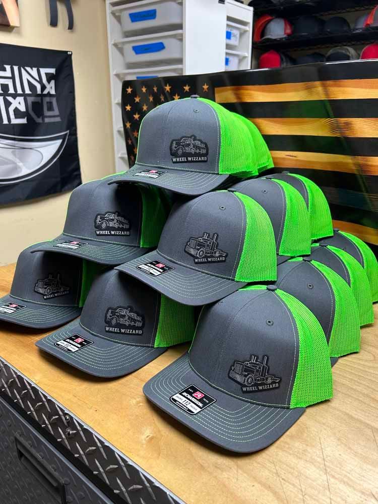 A bunch of hats are stacked on top of each other on a table.