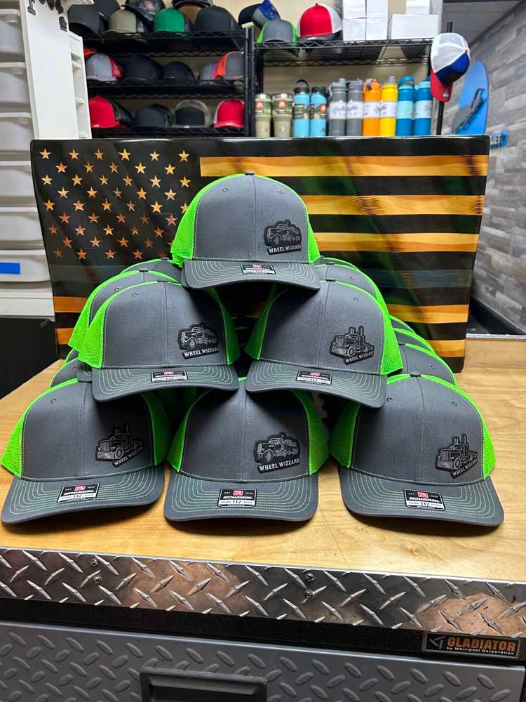 A bunch of hats are stacked on top of each other on a table.