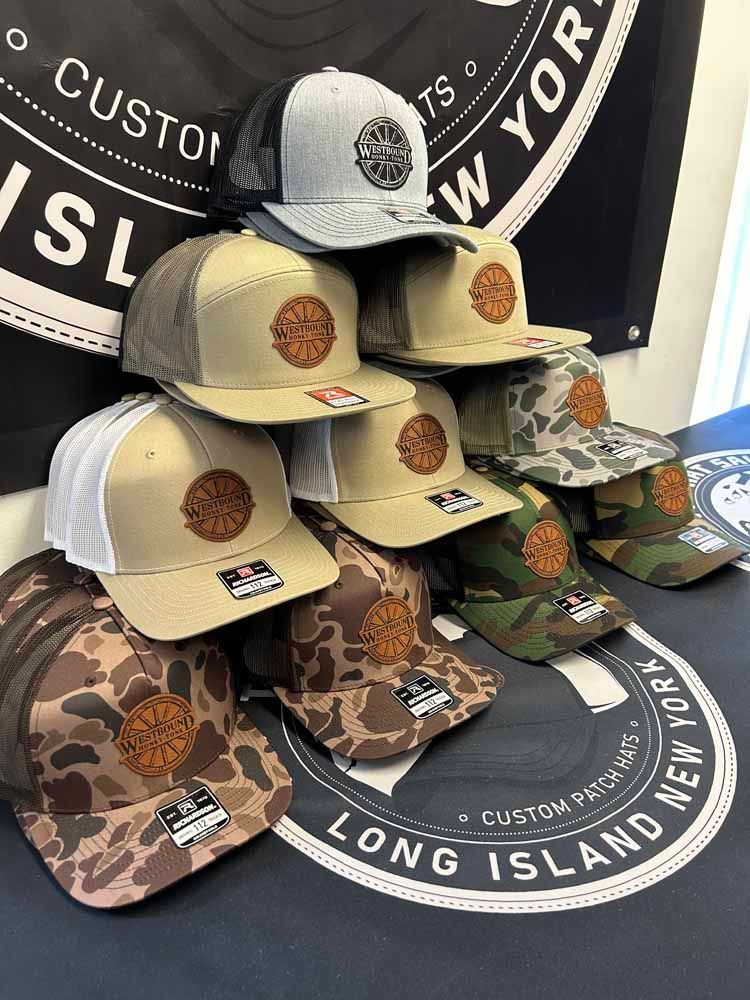 A bunch of hats are stacked on top of each other on a table.