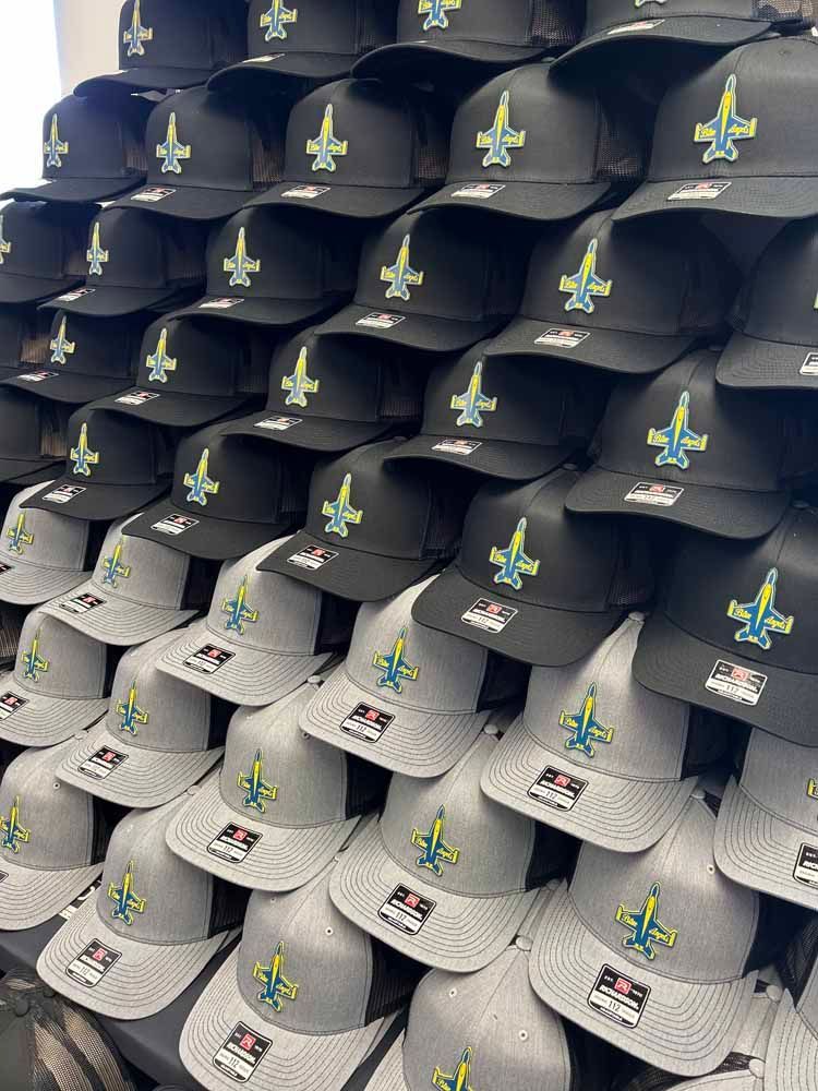 A bunch of hats are stacked on top of each other.