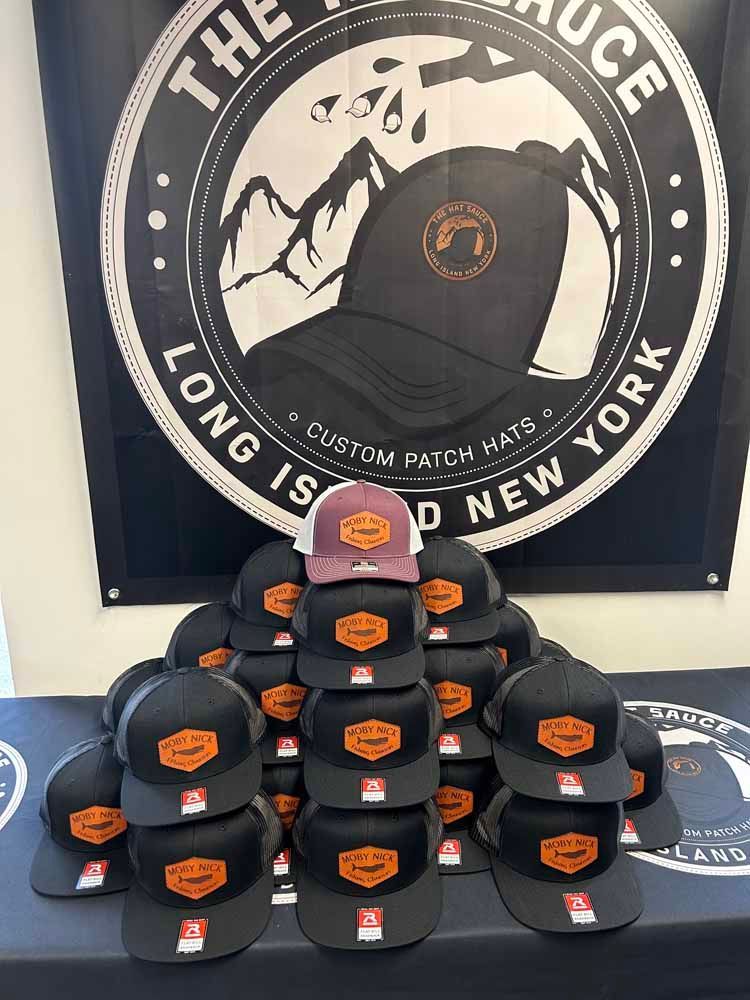 A bunch of hats are stacked on top of each other on a table.