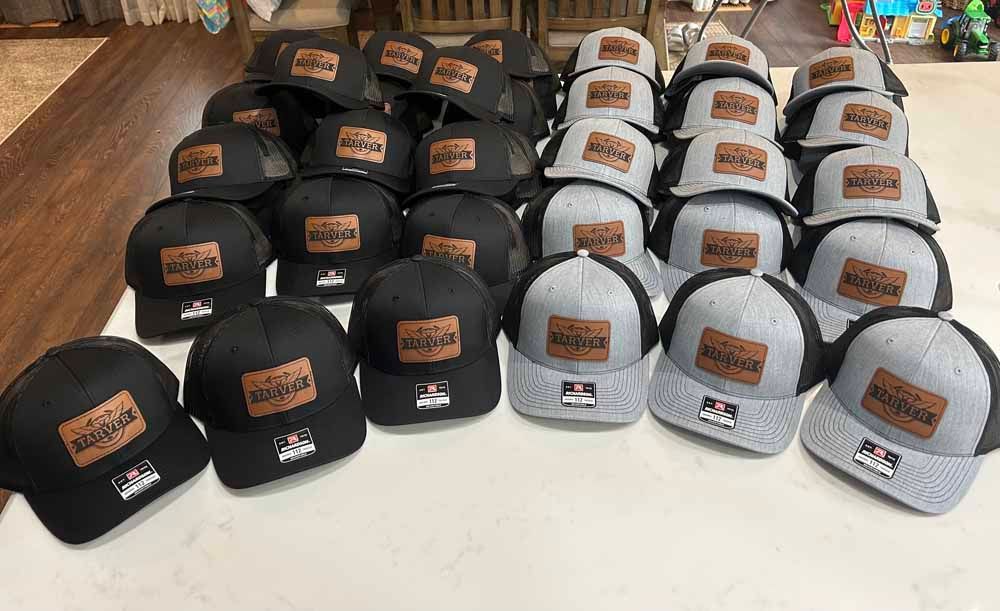 A bunch of hats are sitting on a table.