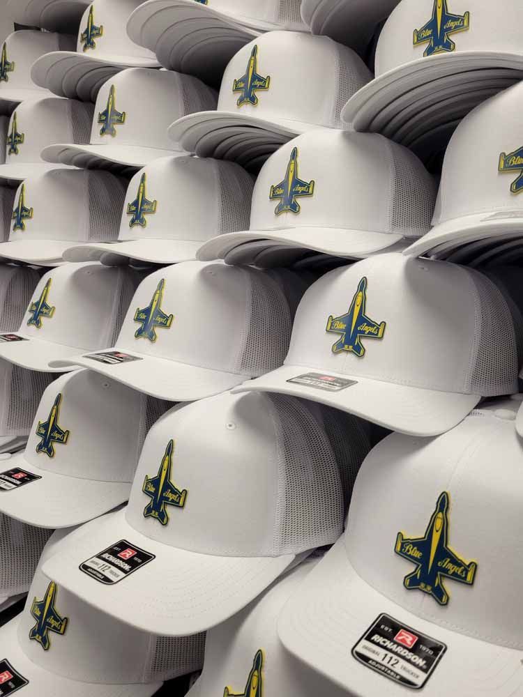 A bunch of white hats with airplanes on them