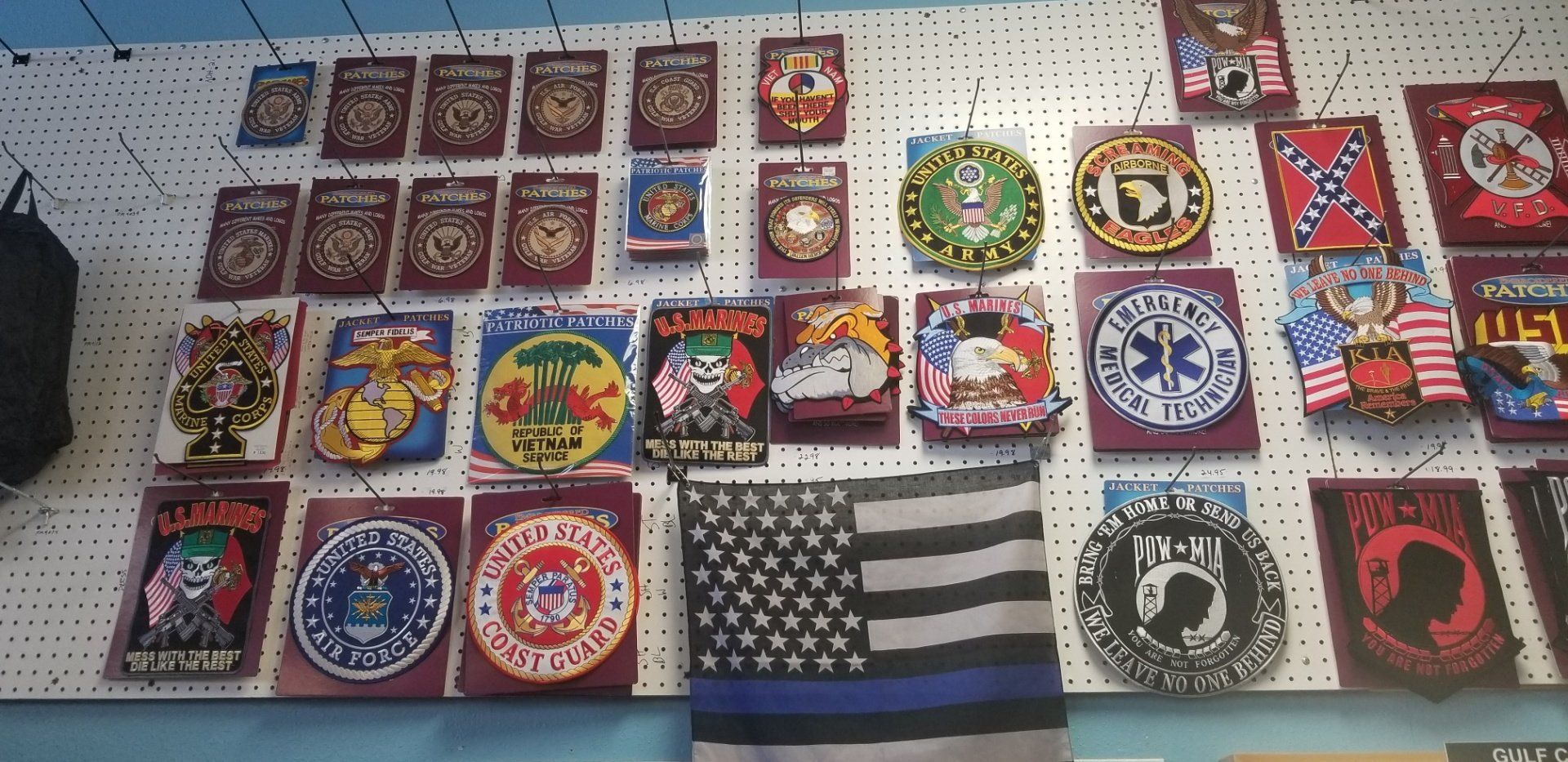 Large assortment of military patches and stickers