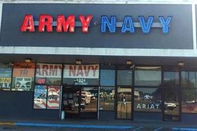 Army Navy storefront with red and blue sign above glass doors and windows