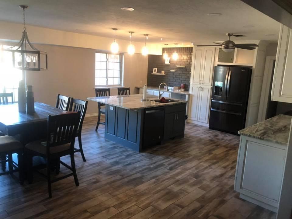 There is a large island in the middle of the kitchen.