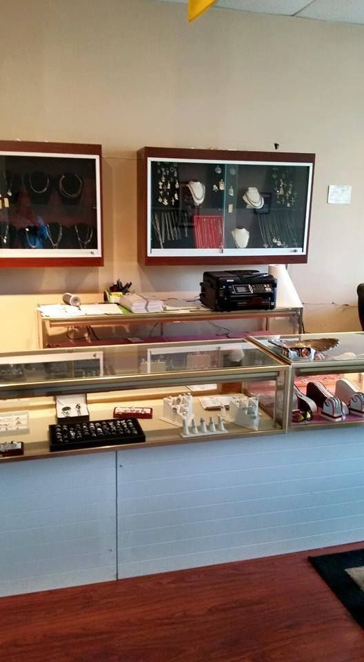 Jewelry store interior with display cases, jewelry, and display cabinets with more jewelry.