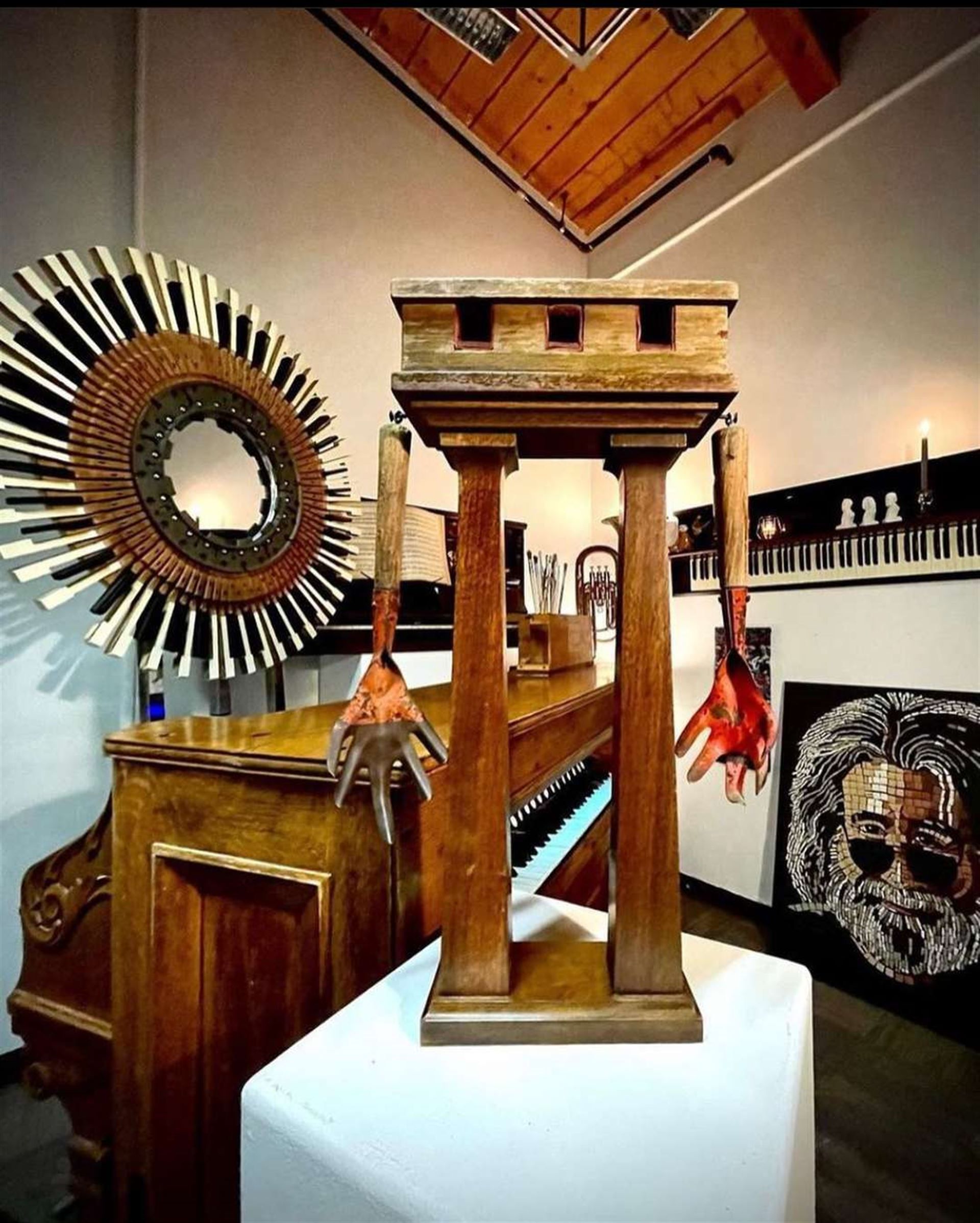 A wooden sculpture is on display in a room