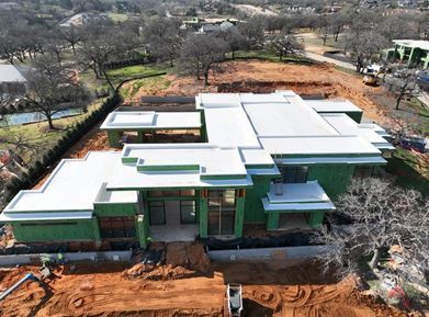 An aerial view of a house that is being built