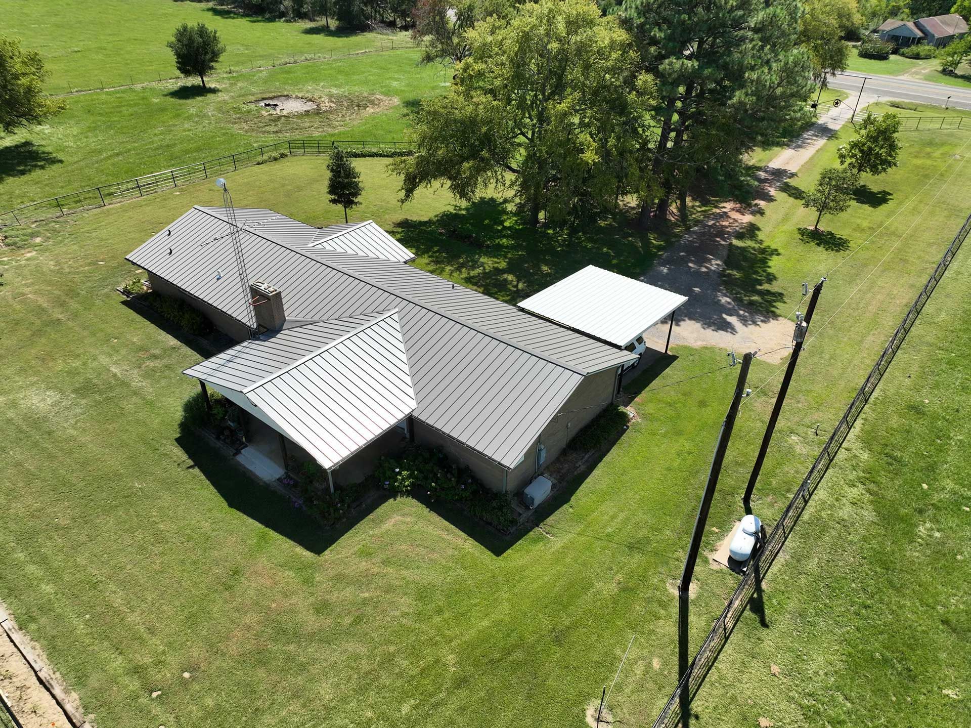 An aerial view of a house with a new roof