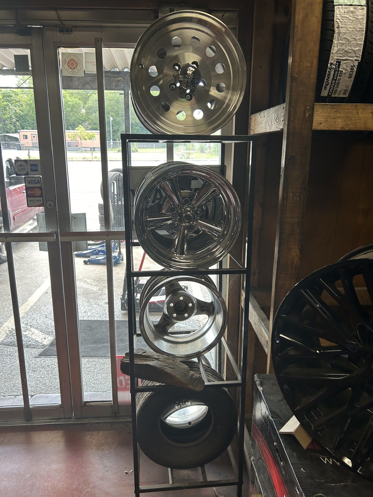 A display of wheels and tires in a store.