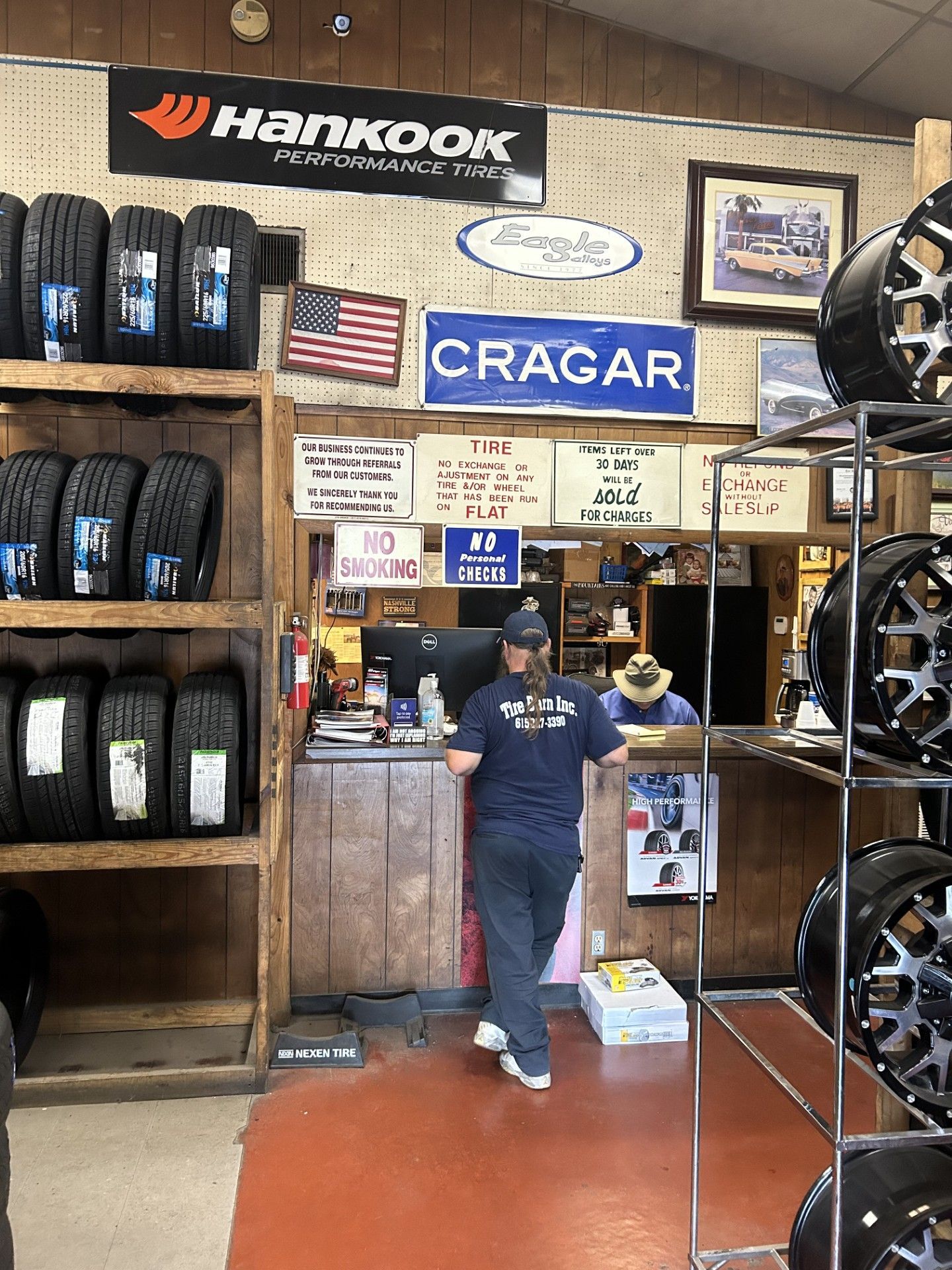 A man standing in front of a sign that says cragar